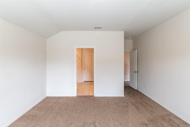 3929 Dickinson Ave, Aubrey, TX 76227 - unfurnished bedroom featuring light carpet, lofted ceiling, and baseboards