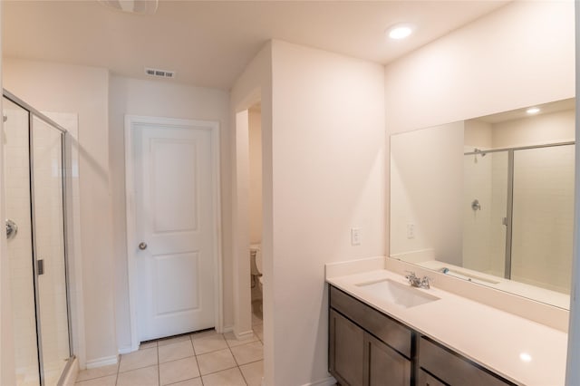 3929 Dickinson Ave, Aubrey, TX 76227 - bathroom featuring a stall shower, baseboards, tile patterned flooring, vanity, and recessed lighting