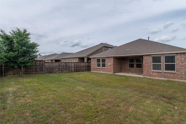3929 Dickinson Ave, Aubrey, TX 76227 - rear view of house with brick siding, a patio area, and a shingled roof