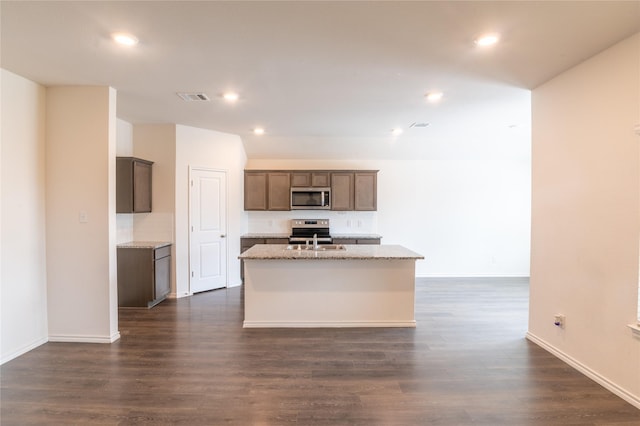 3929 Dickinson Ave, Aubrey, TX 76227 - kitchen with appliances with stainless steel finishes, an island with sink, dark wood-style floors, baseboards, and recessed lighting