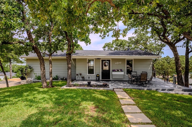8 Tula Ct, Nocona, TX 76255 - back of property featuring a yard and a wooden deck