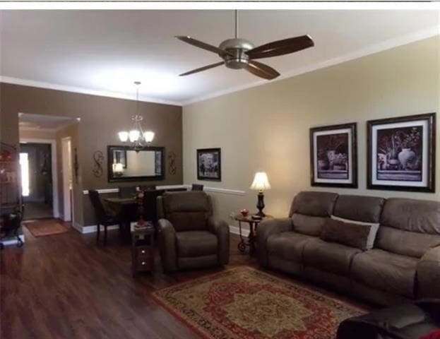 827 Kitty Hawk Ln, Grand Prairie, TX 75051 - living room with crown molding, dark wood-style flooring, a chandelier, a ceiling fan, and baseboards