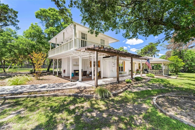 218 Rainbow Dr, Woodway, TX 76712 - rear view of house featuring a patio, a pergola, and fence
