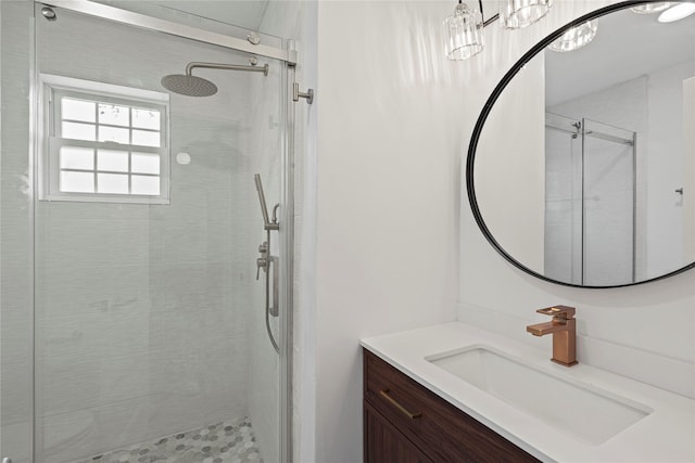 bathroom featuring a stall shower and vanity