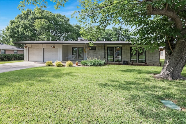 405 Martin Ln, Euless, TX 76040 - view of front facade featuring a garage, brick siding, a front yard, and driveway