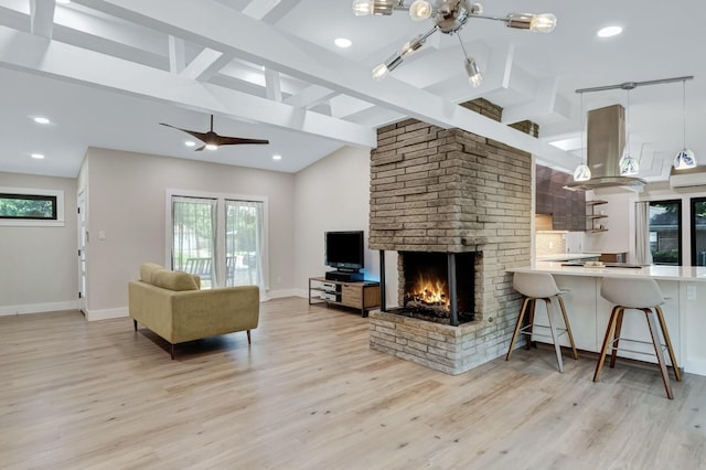 405 Martin Ln, Euless, TX 76040 - living area with light wood finished floors, a brick fireplace, a chandelier, baseboards, and recessed lighting