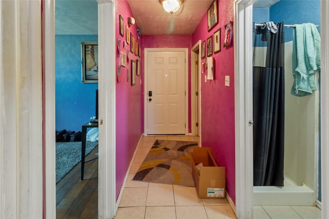 3602 Lamesa Dr, Garland, TX 75041 - hall with tile patterned floors and baseboards