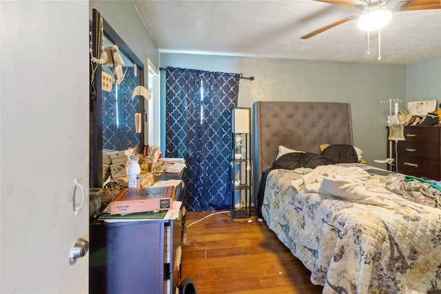 3602 Lamesa Dr, Garland, TX 75041 - bedroom with wood finished floors and a ceiling fan