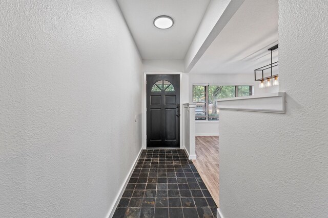 600 Circleview Dr N, Hurst, TX 76054 - doorway featuring baseboards and a textured wall