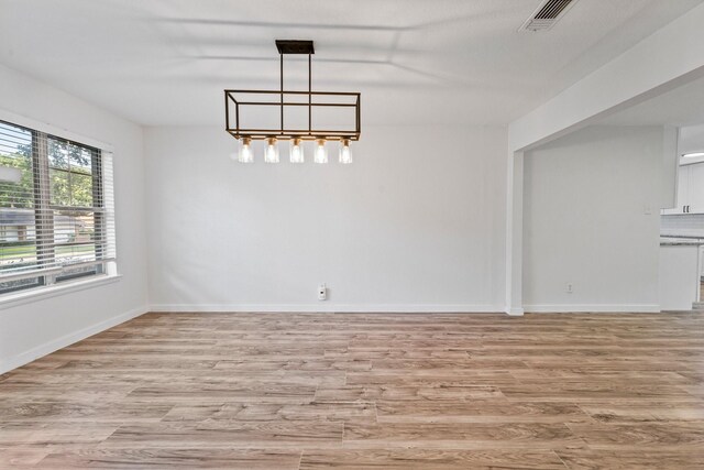 600 Circleview Dr N, Hurst, TX 76054 - unfurnished dining area featuring light wood finished floors and baseboards