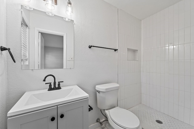 600 Circleview Dr N, Hurst, TX 76054 - full bathroom with toilet, vanity, and a tile shower