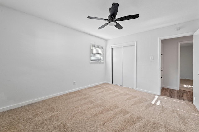 600 Circleview Dr N, Hurst, TX 76054 - unfurnished bedroom featuring carpet floors, a closet, baseboards, and a ceiling fan