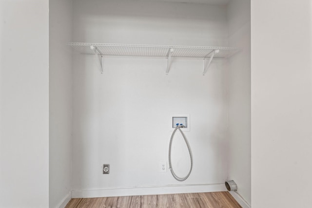 600 Circleview Dr N, Hurst, TX 76054 - laundry room featuring hookup for an electric dryer, hookup for a washing machine, and light wood-style flooring
