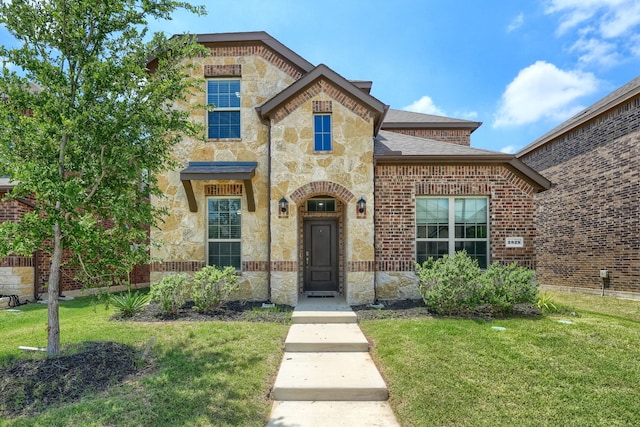 2825 Hale Rd, Celina, TX 75009 - french provincial home with stone siding, a front lawn, and brick siding