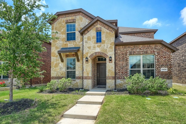 2825 Hale Rd, Celina, TX 75009 - french provincial home featuring stone siding, a front lawn, brick siding, and roof with shingles