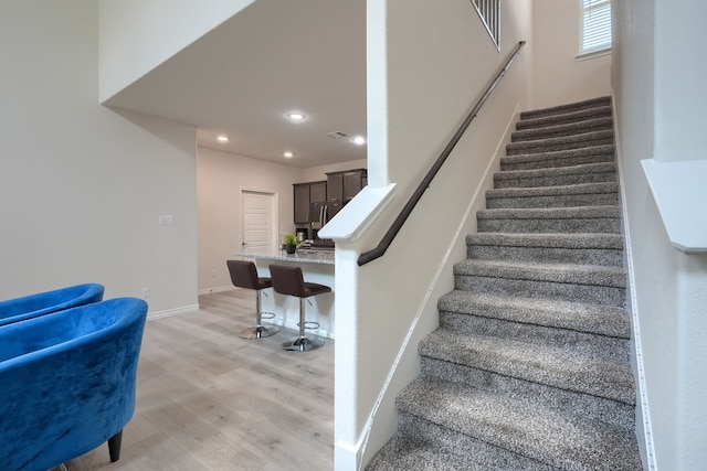 2825 Hale Rd, Celina, TX 75009 - staircase featuring wood finished floors, recessed lighting, and baseboards