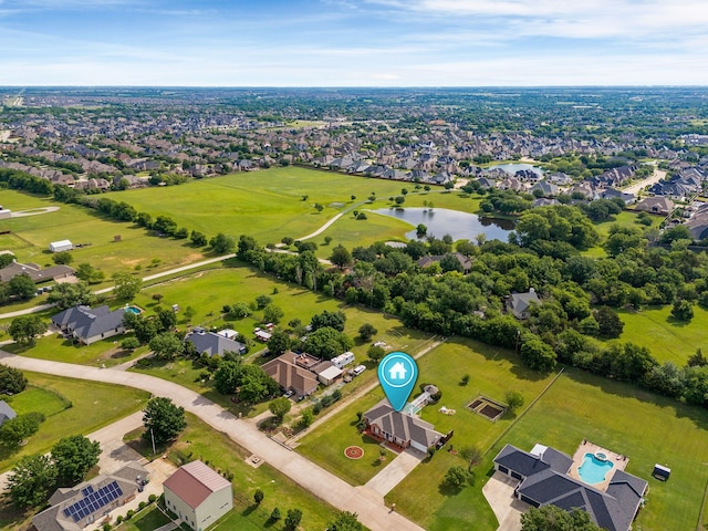 aerial perspective of suburban area with a large body of water