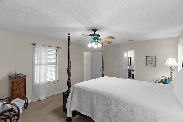 bedroom with carpet flooring, baseboards, ceiling fan, and a textured ceiling