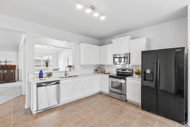 813 Canyon Pl, Desoto, TX 75115 - kitchen with appliances with stainless steel finishes, a sink, light countertops, and white cabinetry