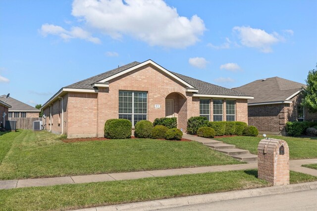 813 Canyon Pl, Desoto, TX 75115 - ranch-style home featuring brick siding, cooling unit, and roof with shingles