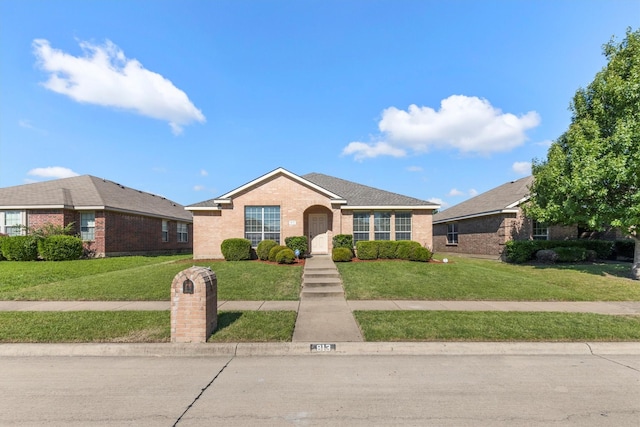 813 Canyon Pl, Desoto, TX 75115 - view of front of property with brick siding and a front lawn