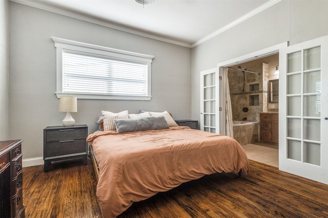 1009 W 7th St, Justin, TX 76247 - bedroom with ornamental molding, wood finished floors, and connected bathroom