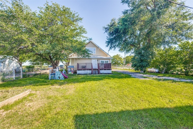 1009 W 7th St, Justin, TX 76247 - back of property featuring a wooden deck