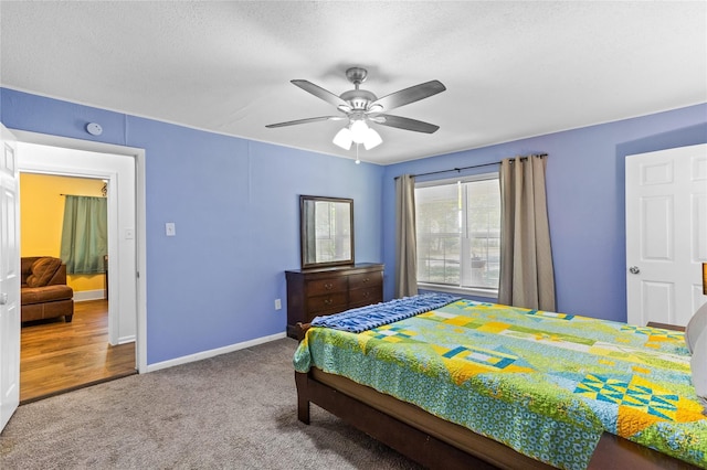 200 S Mimosa St, Paradise, TX 76073 - bedroom with carpet flooring, a ceiling fan, baseboards, and a textured ceiling