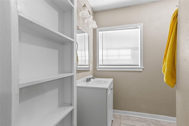 200 S Mimosa St, Paradise, TX 76073 - laundry room with light marble finish flooring, a sink, and baseboards