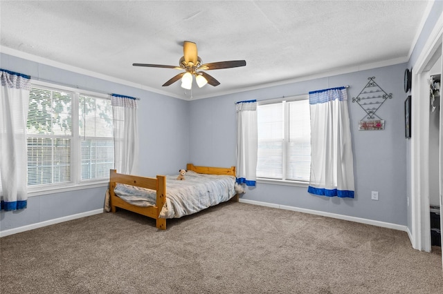 200 S Mimosa St, Paradise, TX 76073 - bedroom featuring carpet, ornamental molding, baseboards, a textured ceiling, and a ceiling fan