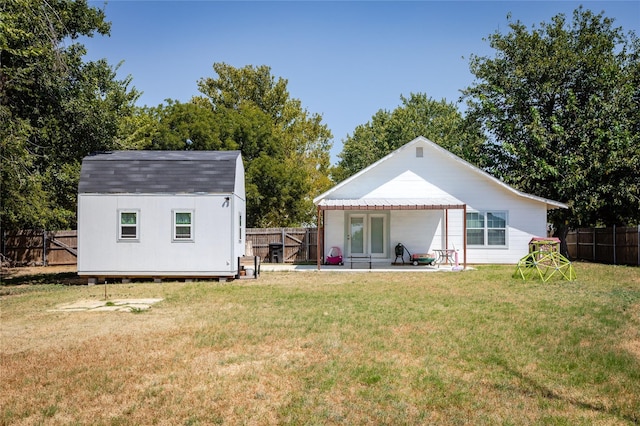 200 S Mimosa St, Paradise, TX 76073 - back of property featuring an outbuilding, a shed, a patio area, and french doors