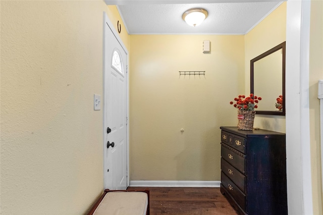 200 S Mimosa St, Paradise, TX 76073 - entryway with dark wood finished floors, crown molding, baseboards, and a textured ceiling