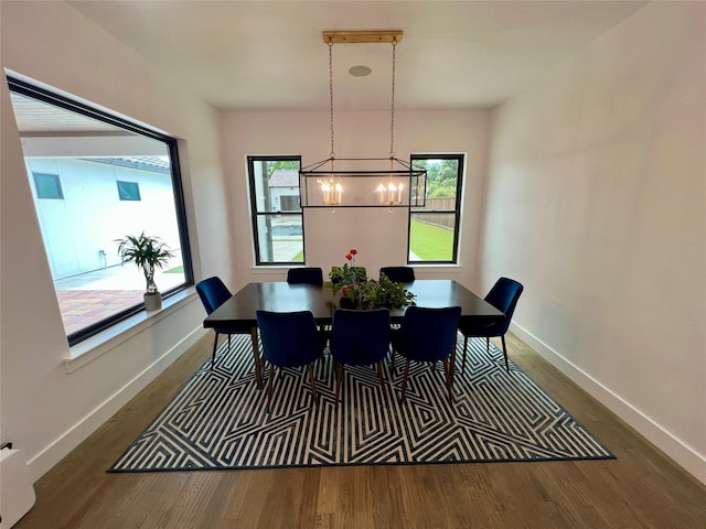 613 Wildcat Way, Kennedale, TX 76060 - dining space featuring a chandelier, wood finished floors, and baseboards