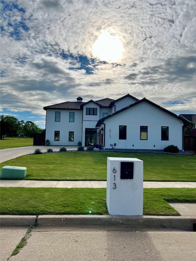 613 Wildcat Way, Kennedale, TX 76060 - view of front of home featuring a front lawn, stucco siding, and a tile roof