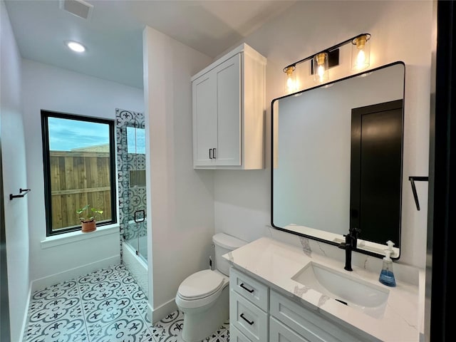 613 Wildcat Way, Kennedale, TX 76060 - bathroom featuring toilet, baseboards, vanity, bath / shower combo with glass door, and tile patterned floors