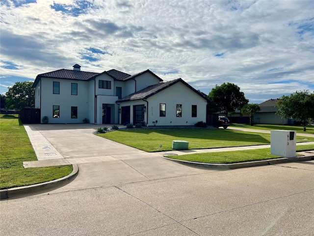 613 Wildcat Way, Kennedale, TX 76060 - view of front of home featuring curved driveway, stucco siding, and a front yard