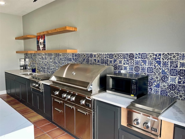 613 Wildcat Way, Kennedale, TX 76060 - kitchen featuring a sink, decorative backsplash, open shelves, stovetop, and tile patterned floors