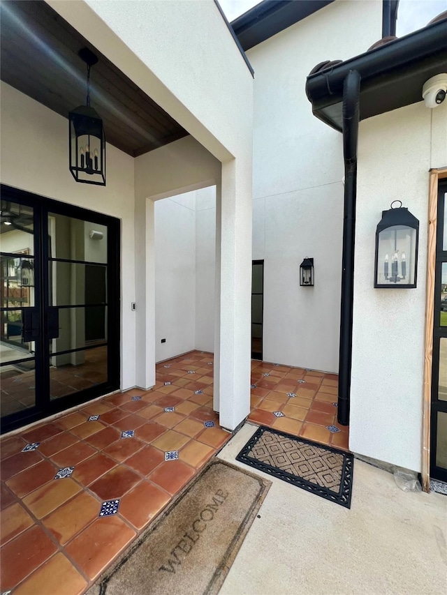 613 Wildcat Way, Kennedale, TX 76060 - property entrance with stucco siding, a surveillance system, and french doors