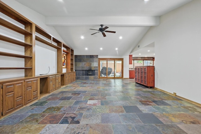 unfurnished living room with ceiling fan, stone tile floors, baseboards, a tiled fireplace, and recessed lighting