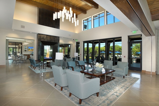 tiled living room with a towering ceiling, wooden ceiling, and beamed ceiling