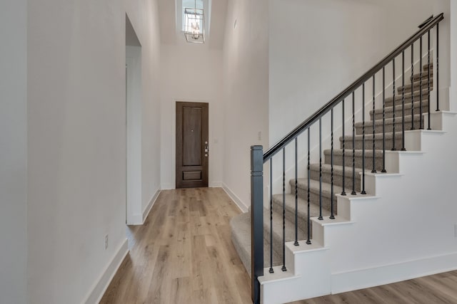 14936 Grissom Ave, Aledo, TX 76008 - foyer entrance featuring a towering ceiling, wood finished floors, stairs, and baseboards