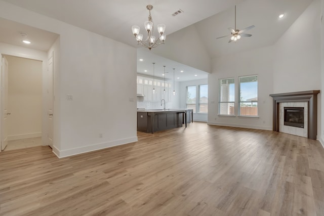 14936 Grissom Ave, Aledo, TX 76008 - unfurnished living room featuring ceiling fan, light wood finished floors, a sink, baseboards, and recessed lighting