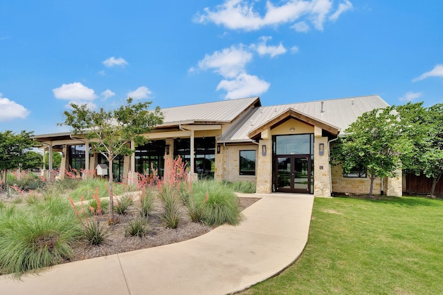 14936 Grissom Ave, Aledo, TX 76008 - view of front of house featuring stone siding, a front yard, french doors, and metal roof