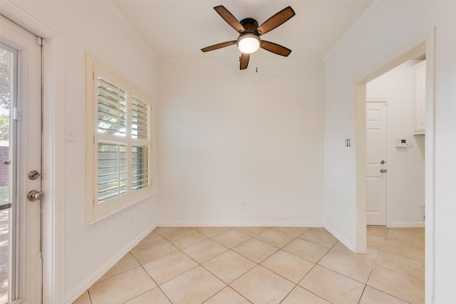 8525 Creekview Dr, Frisco, TX 75034 - empty room featuring ornamental molding, ceiling fan, plenty of natural light, light tile patterned floors, and baseboards