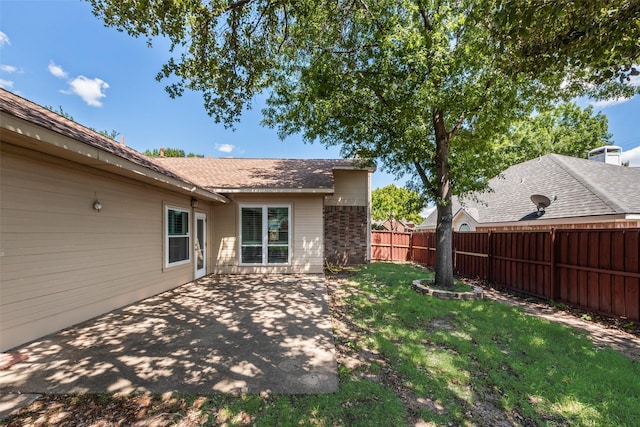 8525 Creekview Dr, Frisco, TX 75034 - back of house with a patio and brick siding