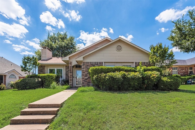 8525 Creekview Dr, Frisco, TX 75034 - ranch-style home with a front yard, brick siding, and a chimney