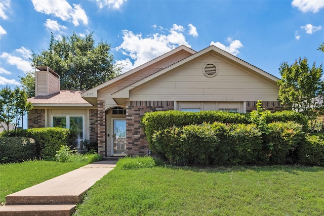 8525 Creekview Dr, Frisco, TX 75034 - ranch-style house featuring a front lawn, a chimney, and brick siding