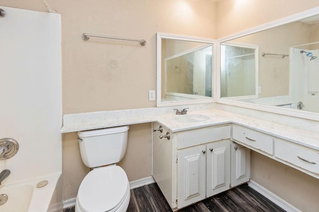 full bathroom featuring toilet, wood finished floors, and vanity