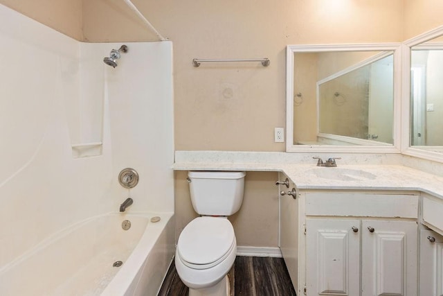 full bath featuring shower / washtub combination, toilet, vanity, and wood finished floors