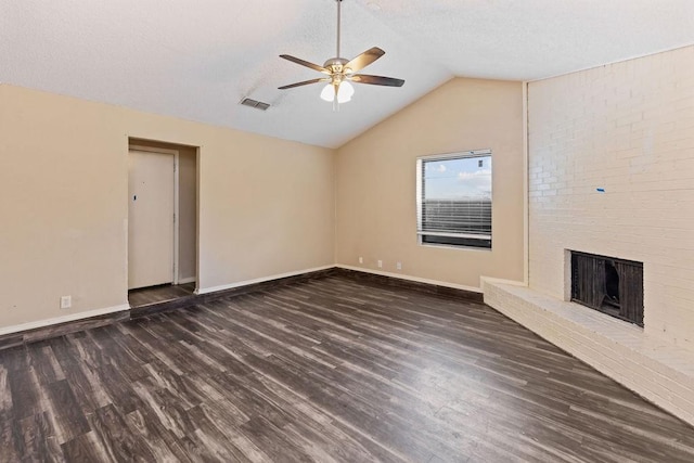 unfurnished living room with wood finished floors, ceiling fan, vaulted ceiling, baseboards, and a fireplace
